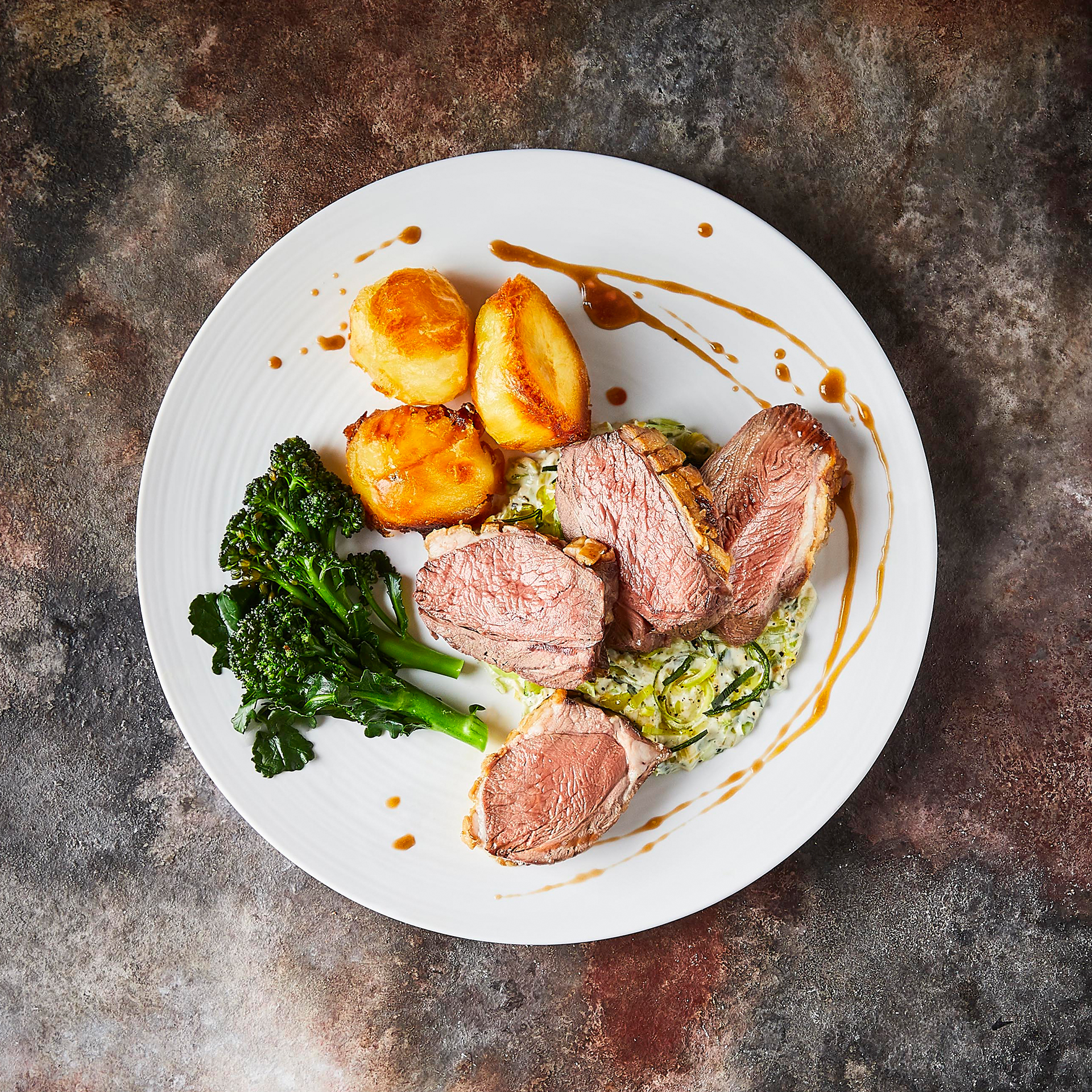 Roast Lamb, Creamed Leek, Purple Sprouting Broccoli & Redcurrant Jus